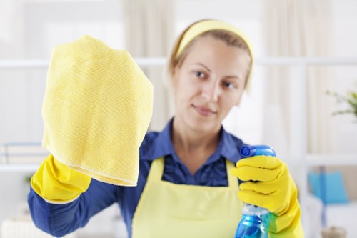 Cleaner tidying a residential property with stair access in NW11