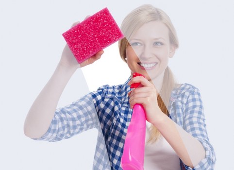Cleaner wearing PPE while working on a carpeted floor